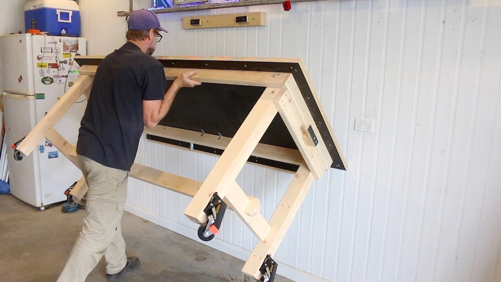 Image of Wall Mounted Workbench being Lifted