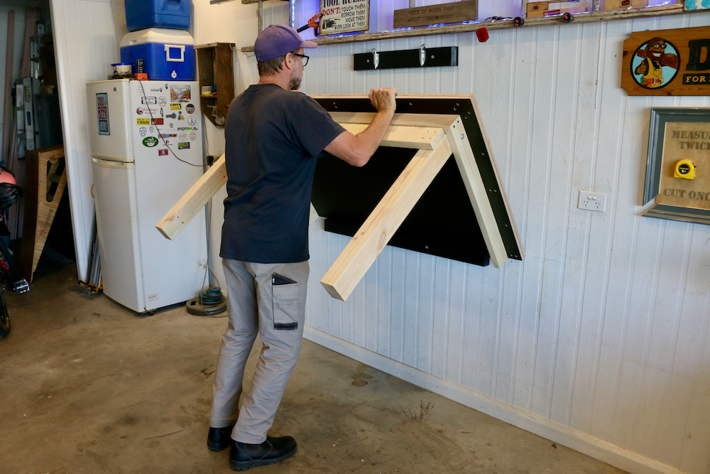 Image of lifting the Fold Down Workbench